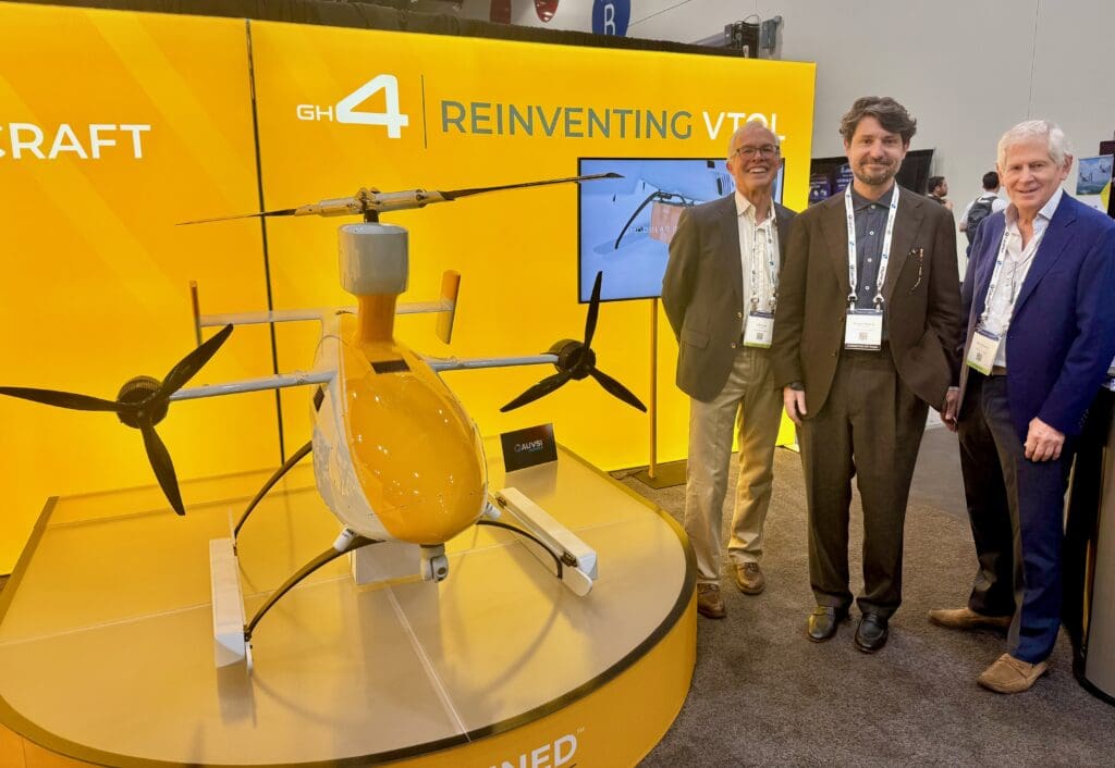 Richard Thomas from Inside Unmanned Systems checks out the Unmanned Aerospace GH-4 drone, with Jeffrey Knapp and Gad Shaanan.